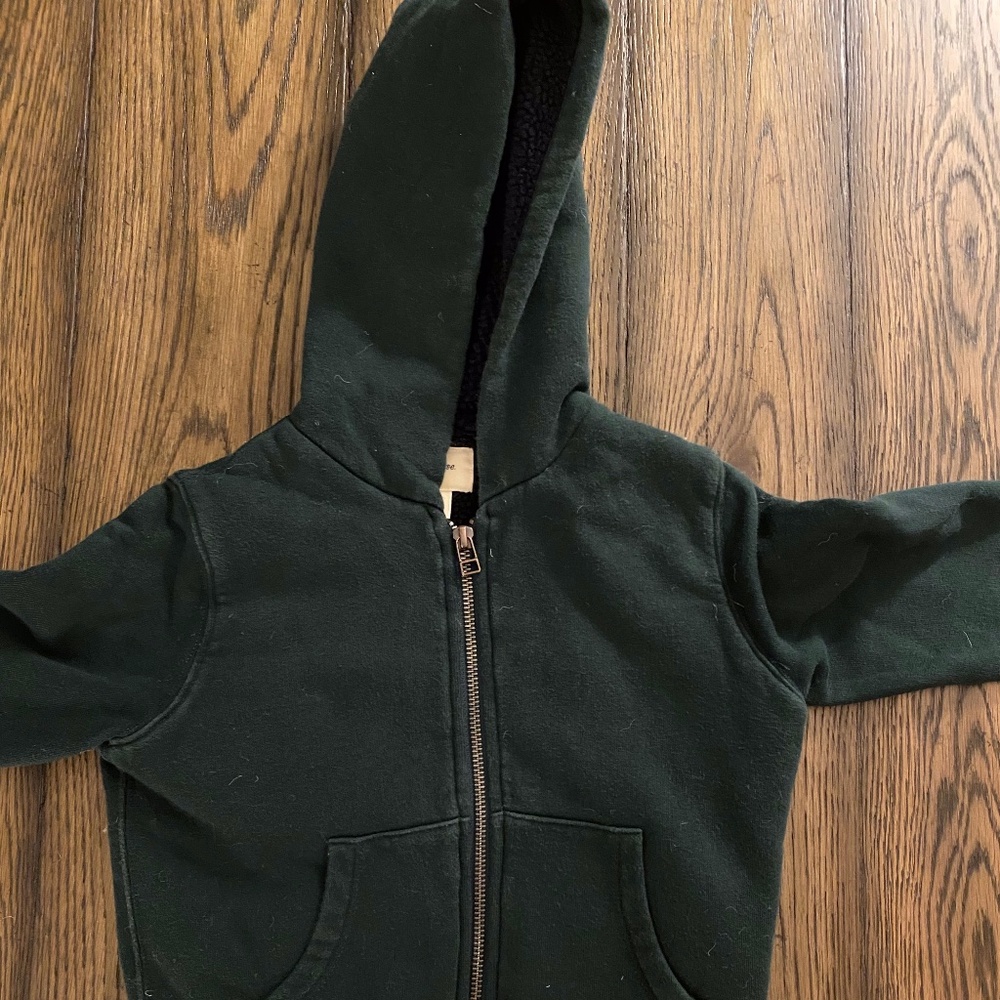 Green zip up jacket with orange stripe